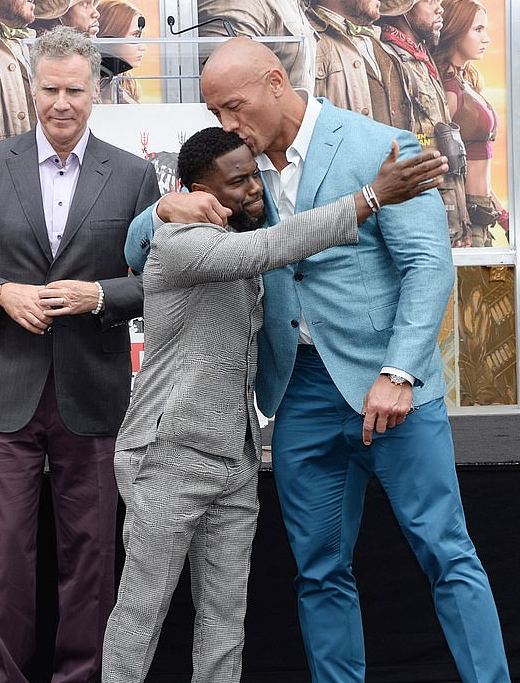 Kevin Hart Receives a Sweeping Kiss from Costar Dwayne ‘The Rock