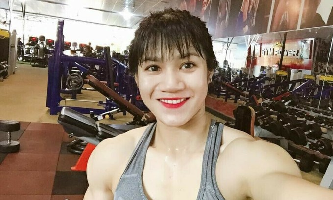 Tran Thi Ny takes a selfie at a gym in Dong Nai Province.